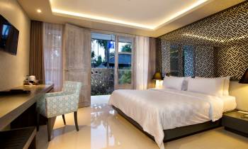 a bedroom with a large bed in a room