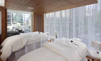 a bedroom with a large bed in a hotel room
