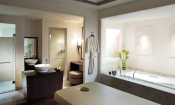 a room with a sink and a mirror