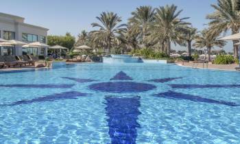 a pool next to a body of water