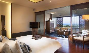 a bedroom with a large bed in a hotel room