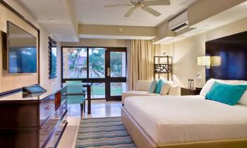 a bedroom with a large bed in a room