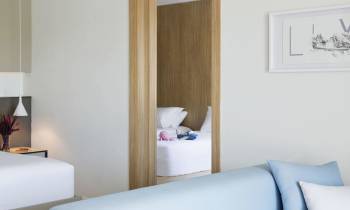 a bedroom with a bed in a room