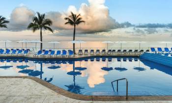 a pool next to a body of water