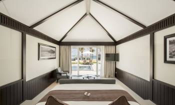 a bedroom with a bed in a room
