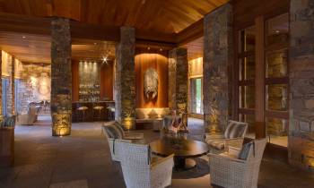 a living room filled with furniture and a fireplace