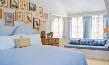 a bedroom with a bed in a room