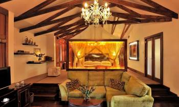 a living room filled with furniture and a fire place