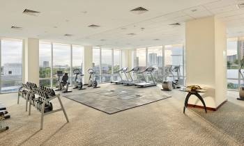 a room filled with furniture and a large window