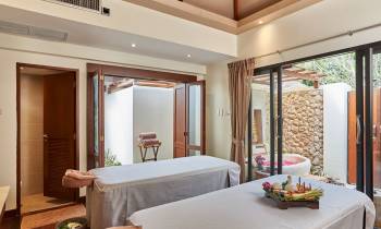 a bedroom with a large window