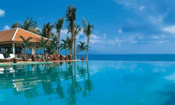 a house with a large pool of water