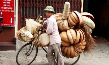 a person holding a bicycle