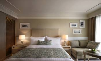 a bedroom with a large bed in a hotel room