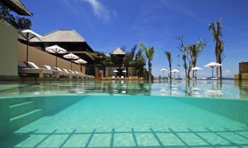 a pool next to a body of water
