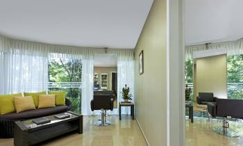 a living room filled with furniture and a large window