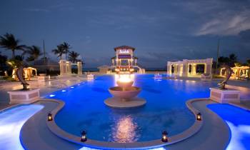 a pool next to a body of water