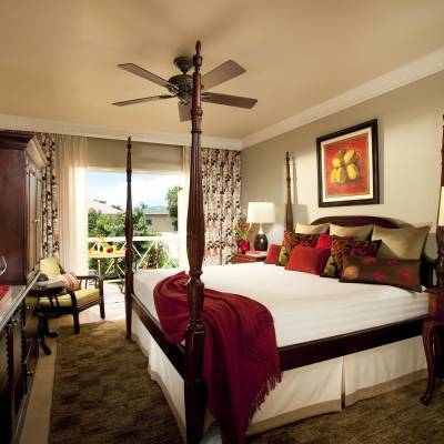 a bedroom with a large bed in a hotel room