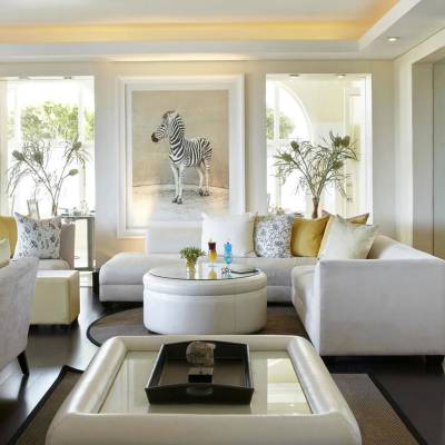 a living room filled with furniture and a fire place