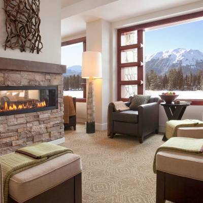 a living room filled with furniture and a fire place
