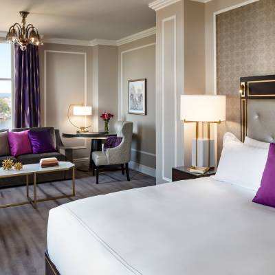 a bedroom with a large bed in a hotel room