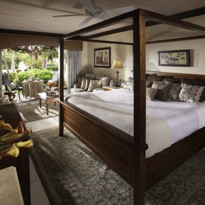 a bedroom with a large bed in a hotel room