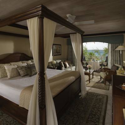 a bedroom with a large bed in a hotel room