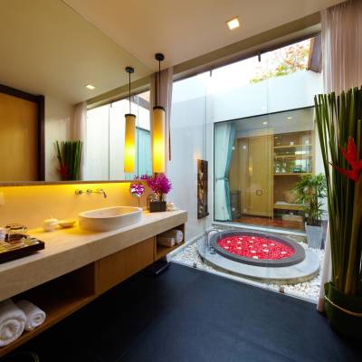 a room with a sink and a mirror