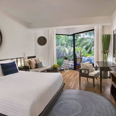 a bedroom with a large bed in a hotel room
