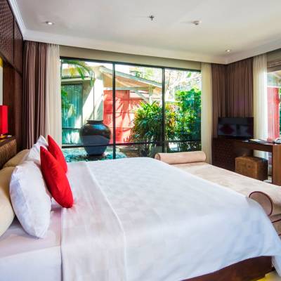 a bedroom with a large bed in a room