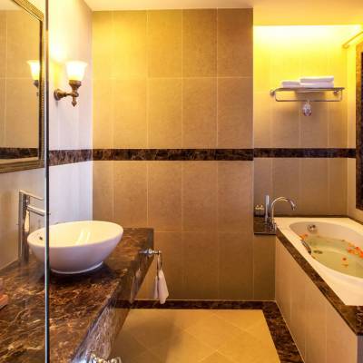 a room with a sink and a mirror