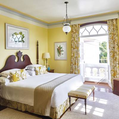 a bedroom with a large bed in a hotel room