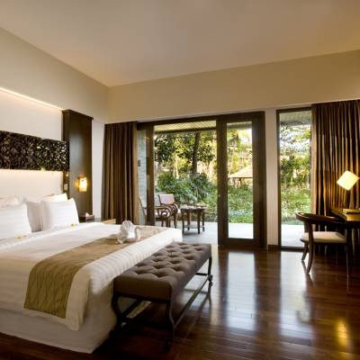 a bedroom with a large bed in a hotel room