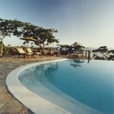 a pool next to a body of water