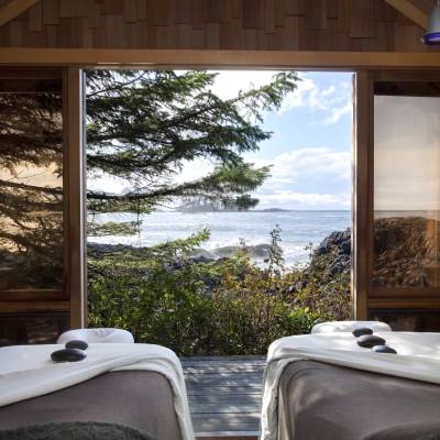 a large bed sitting next to a window