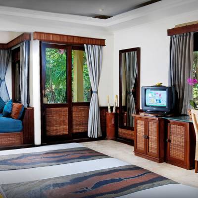 a living room with a bed and a window
