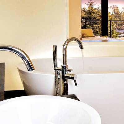 a white sink sitting under a window