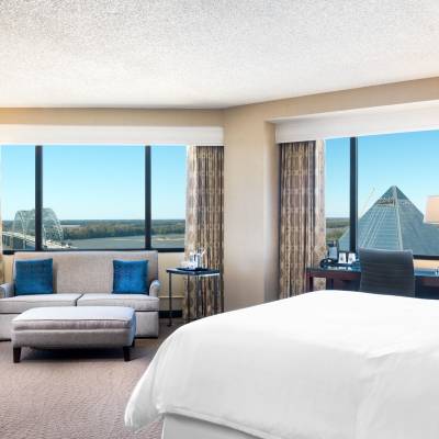 a bedroom with a large bed in a hotel room