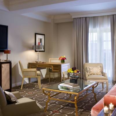 a living room filled with furniture and a flat screen tv
