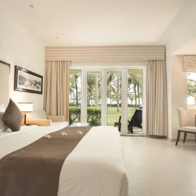 a bedroom with a large bed in a hotel room