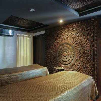 a bedroom with a bed and desk in a room