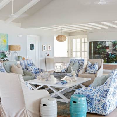 a living room filled with furniture and a large window