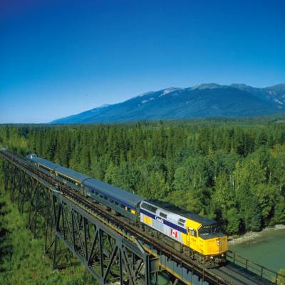 a train crossing a bridge over a river