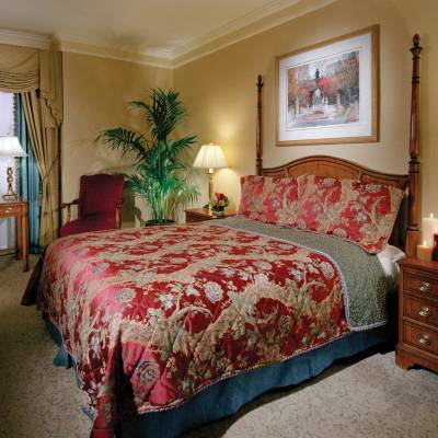 a bedroom with a large bed in a room