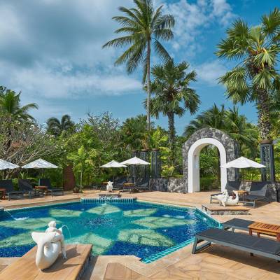a pool next to a palm tree
