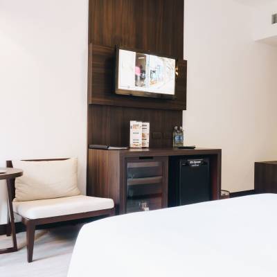 a room filled with furniture and a flat screen tv