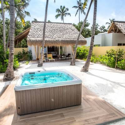 a house with a pool in front of a building