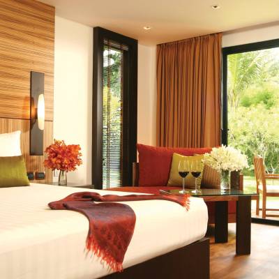 a hotel room with a bed and a large window