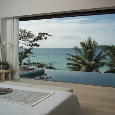 a bedroom with a large window