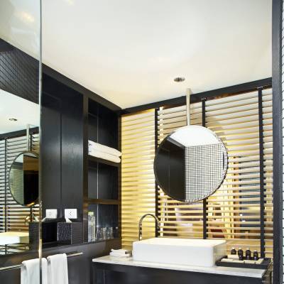 a room with a sink and a mirror