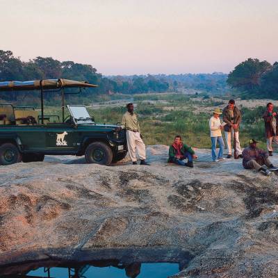 a group of people riding on the back of a truck